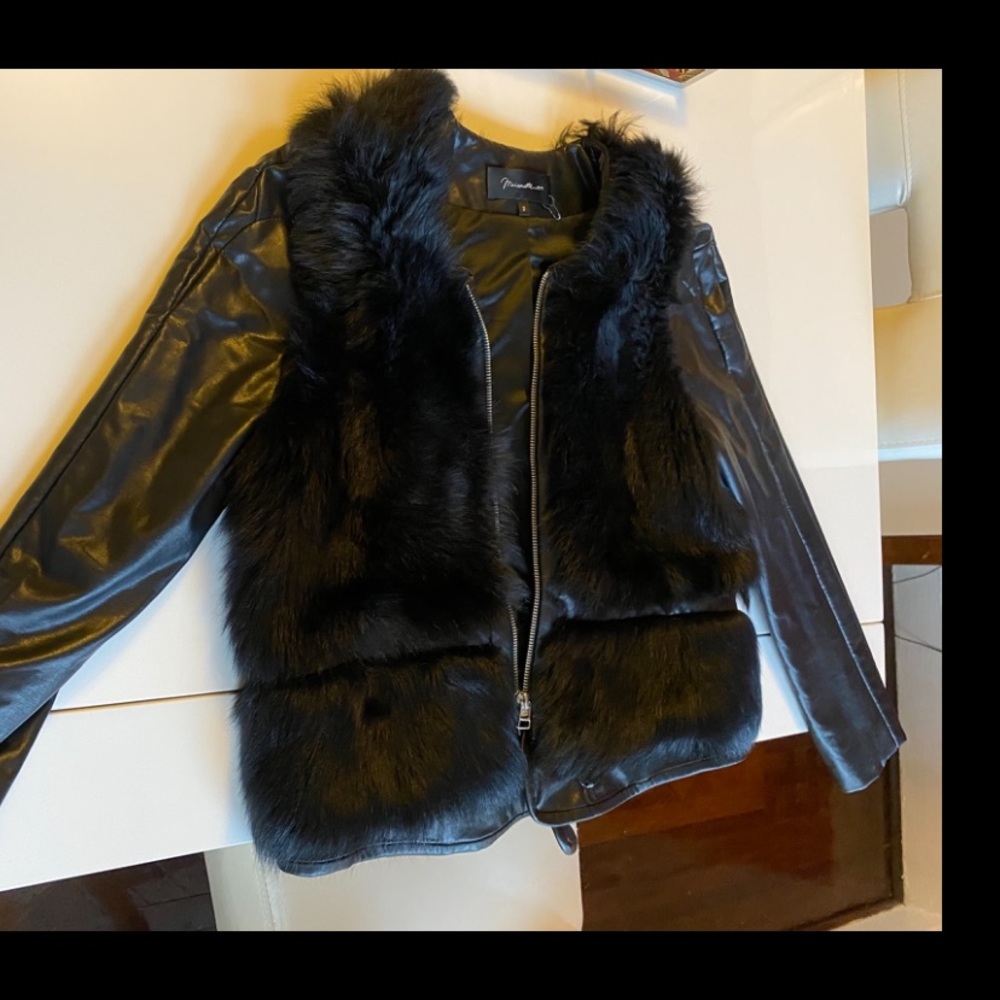 Leather jacket with real fur on sides and back.